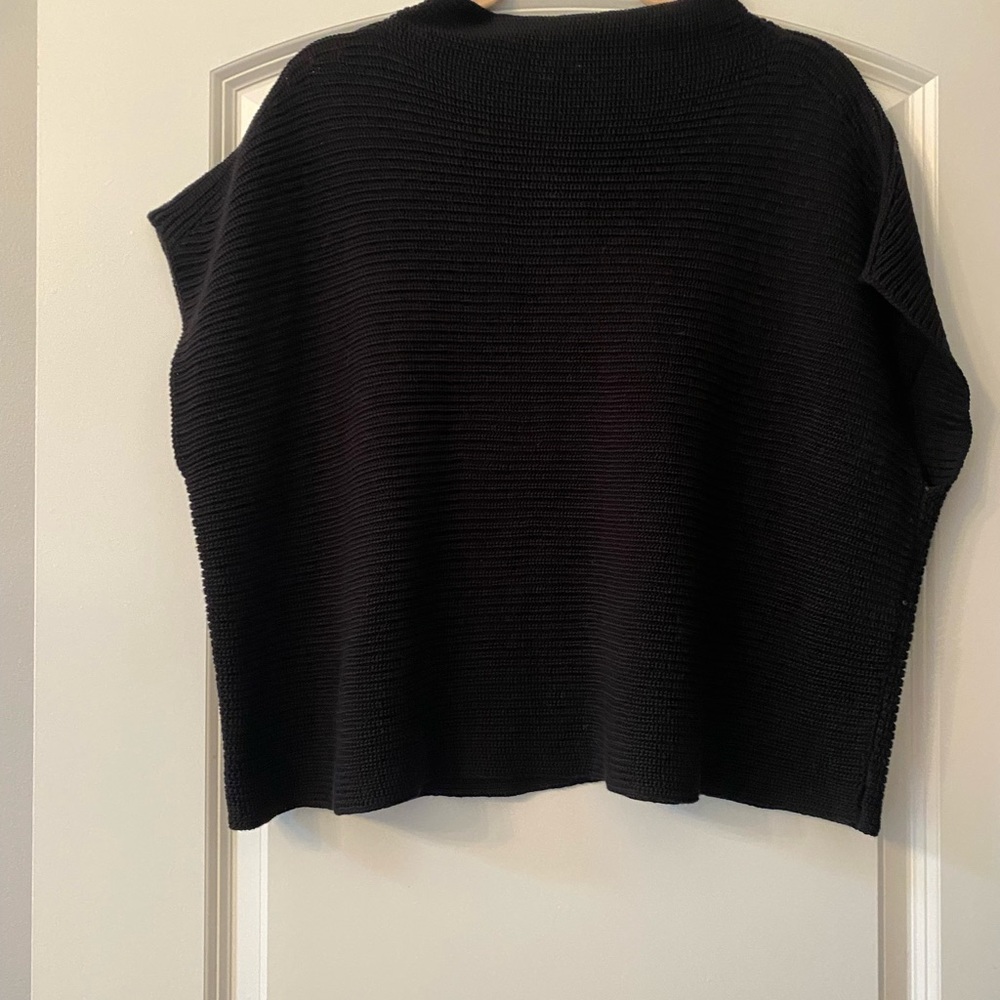 Lightweight sweater. Great with a camisole underneath.